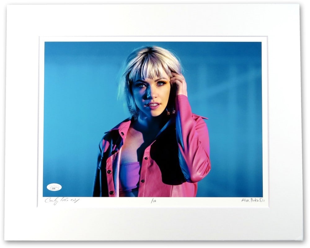 Carly Rae Jepsen autographed original matted photo lithograph JSA: Carly Rae Jepsen autographed original matted photo lithograph JSA Original signed matted photo lithograph featuring Carly Rae Jepsen in a pink jacket. This pre-owned piece is authenticated by James Sp