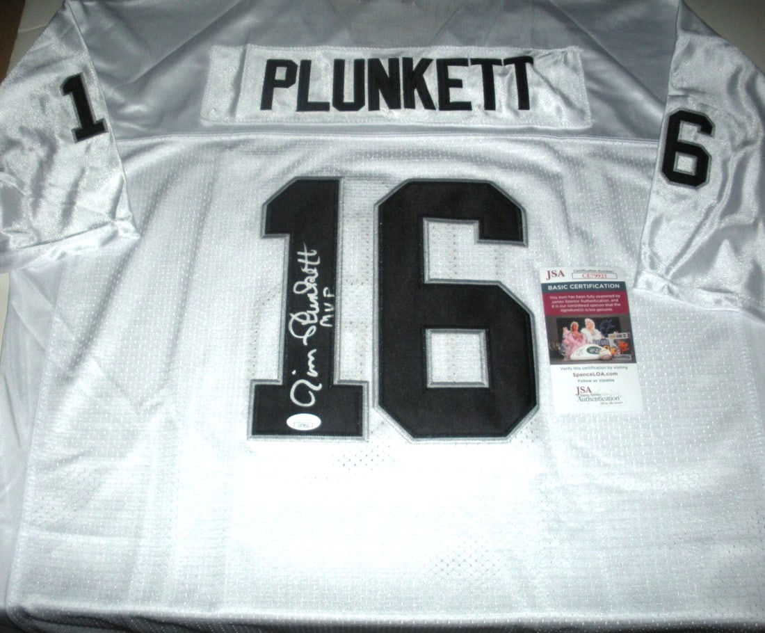 Mitchell & Ness Oakland Raiders Jersey Signed by Jim Plunkett with JSA COA: Mitchell & Ness Oakland Raiders Jersey Signed by Jim Plunkett with JSA COA This official licensed Mitchell & Ness Oakland Raiders jersey is personally signed by Jim Plunkett. The jersey comes with JSA