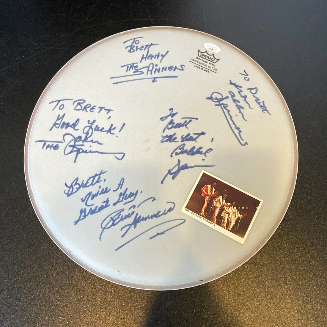 The Spinners Signed Drumhead with 5 Signatures JSA Certified: The Spinners Signed Drumhead with 5 Signatures JSA Certified This autographed drumhead from The Spinners band features five signatures, making it a unique collectible for music enthusiasts. The drumhe