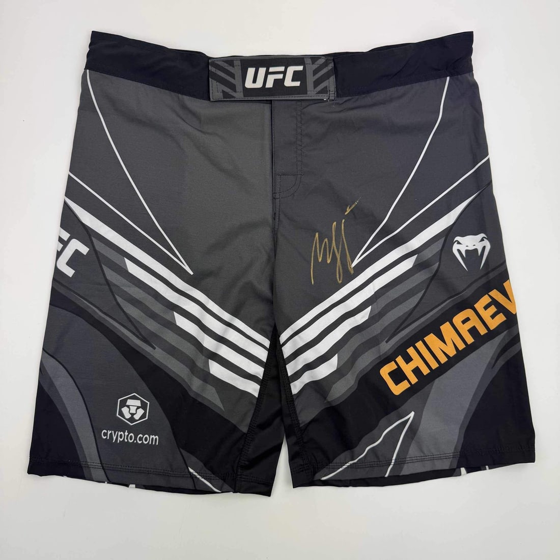 Khamzat Chimaev Signed UFC Black MMA Trunks PSA Certified Autograph: Khamzat Chimaev Signed UFC Black MMA Trunks PSA Certified Autograph These black UFC MMA trunks are autographed by Khamzat Chimaev and come with authentication from Professional Sports Authenticator (P