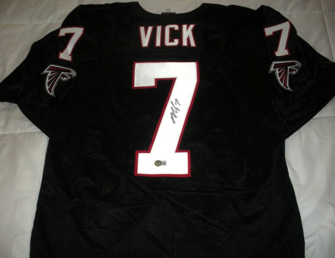 Signed Michael Vick Falcons Wilson NFL Jersey Beckett COA: Signed Michael Vick Falcons Wilson NFL Jersey Beckett COA This is an official licensed Wilson Atlanta Falcons jersey that has been signed by Michael Vick. The jersey comes with a Beckett Certificate o