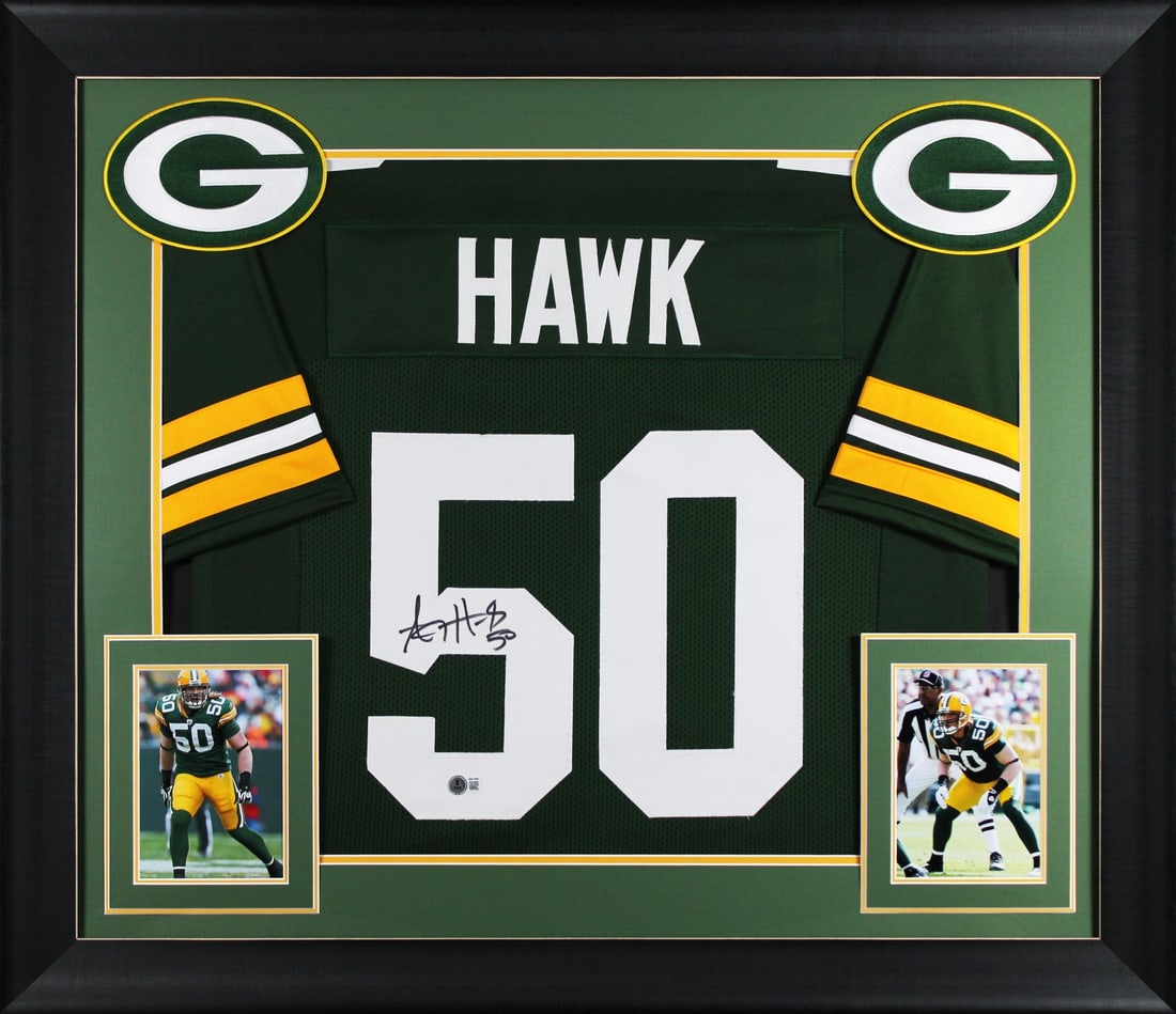 Framed Green Bay Packers Jersey Signed by A.J. Hawk Beckett Witnessed: Framed Green Bay Packers Jersey Signed by A.J. Hawk Beckett Witnessed This autographed Green Pro Style framed jersey has been personally signed by A.J. Hawk of the Green Bay Packers. It is an original