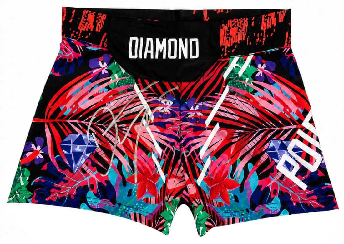 Autographed Dustin Poirier MMA Fight Shorts with COA: Autographed Dustin Poirier MMA Fight Shorts with COA Pre-owned multi-color MMA fighting shorts signed by Dustin Poirier. This original autographed item includes a tamper-proof numbered hologram and a 