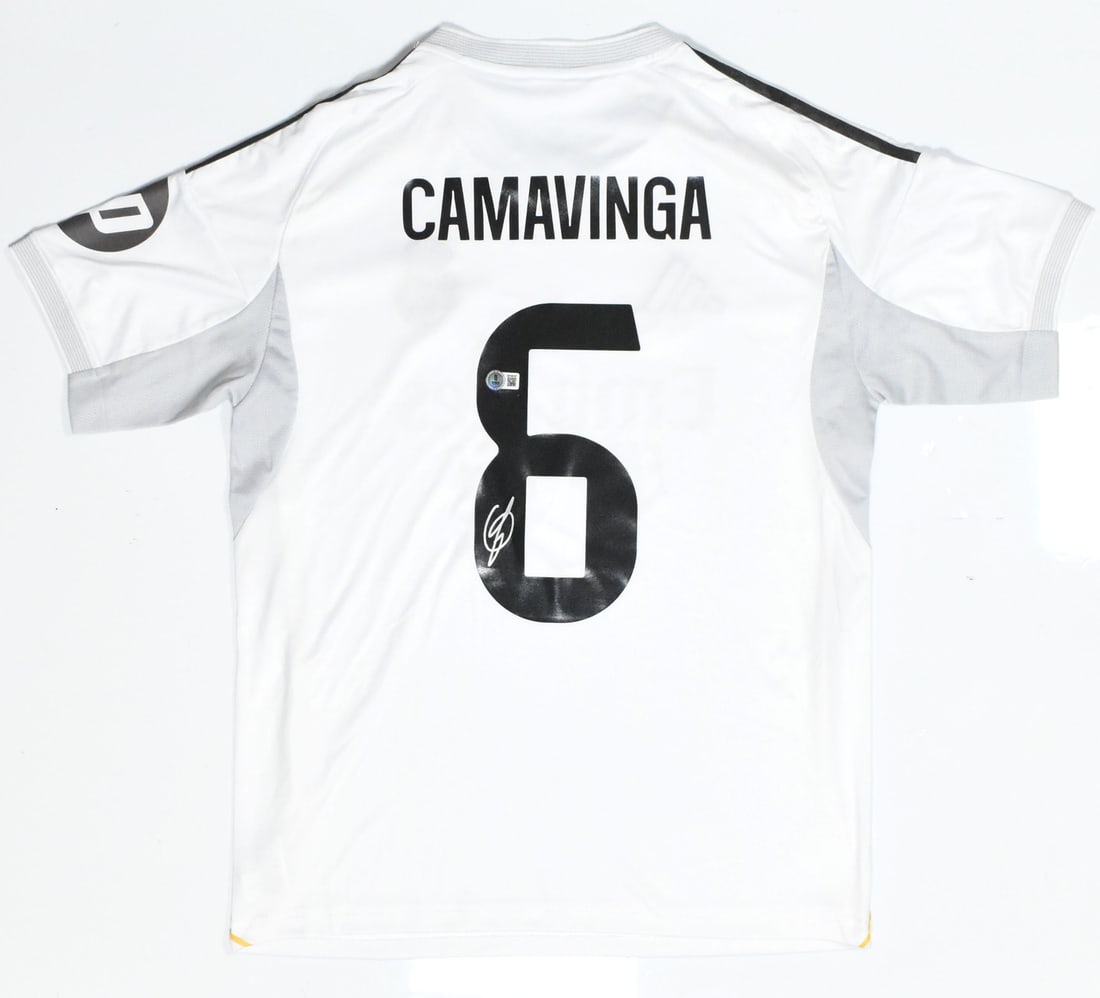 Beckett Holo Signed Real Madrid Camavinga Home Jersey #6: Beckett Holo Signed Real Madrid Camavinga Home Jersey #6 Autographed Real Madrid home soccer jersey featuring Camavinga and number 6. This pre-owned jersey includes a Beckett Witness hologram. Specifi