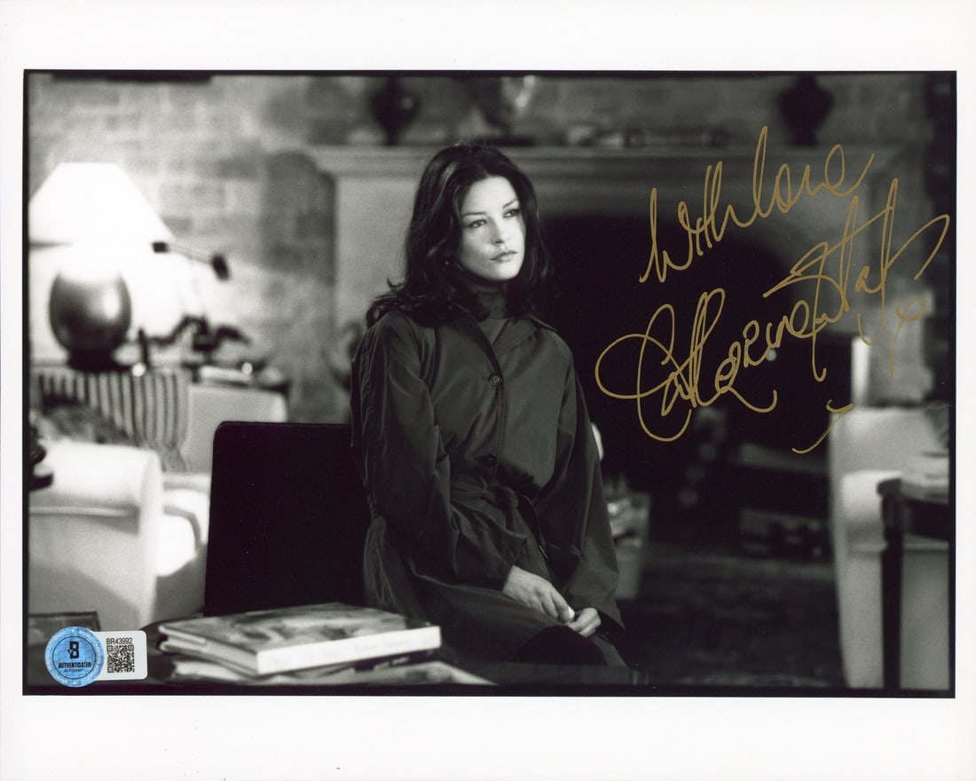 Signed Catherine Zeta-Jones Entrapment 8x10 Photo BAS With Love: Signed Catherine Zeta-Jones Entrapment 8x10 Photo BAS With Love This is a pre-owned horizontal 8x10 photograph from the film Entrapment, personally signed by Catherine Zeta-Jones with the inscription 
