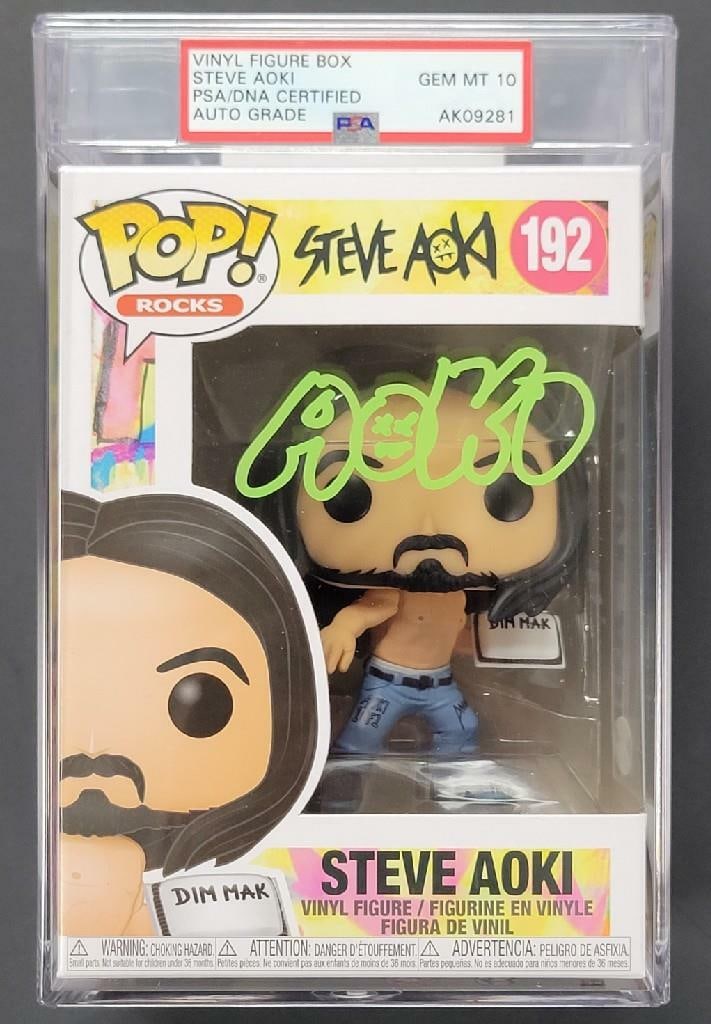 Funko POP DJ Dim Mak Signed by Steve Aoki PSA Gem Mint 10 Authenticated: Funko POP DJ Dim Mak Signed by Steve Aoki PSA Gem Mint 10 Authenticated This is an original Funko POP DJ Dim Mak figure, autographed by Steve Aoki. The signature has been authenticated by PSA/DNA and 