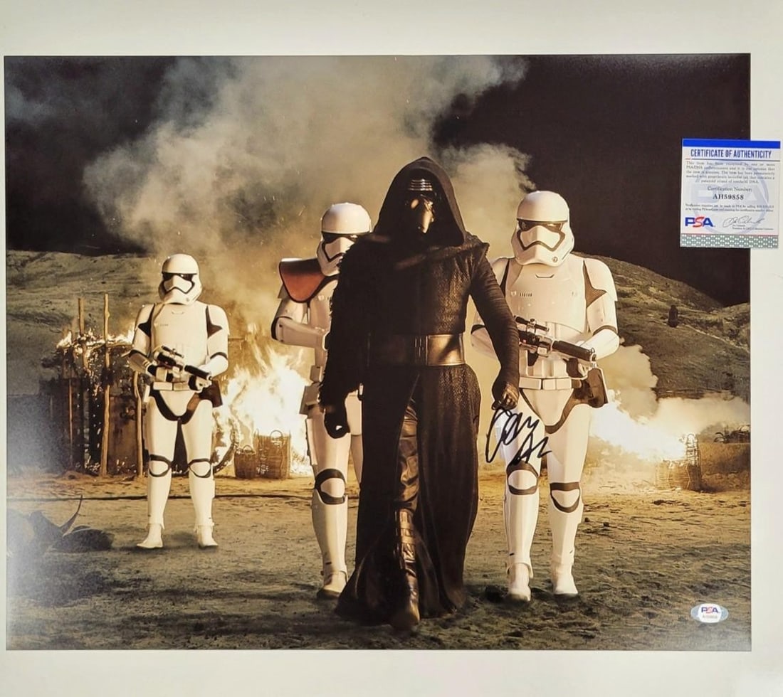 Adam Driver Autographed Star Wars Kylo Ren 16x20 Photo PSA COA: Adam Driver Autographed Star Wars Kylo Ren 16x20 Photo PSA COA This striking 16x20 photograph features Adam Driver's autograph as Kylo Ren from the acclaimed movie Star Wars: The Force Awakens. The im