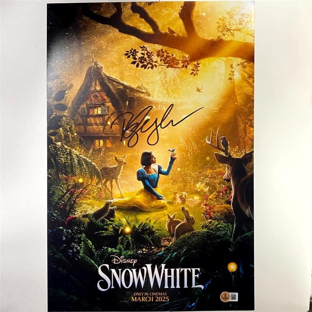 Autographed 12x18 Photograph Rachel Zegler Snow White Beckett Authenticated: Autographed 12x18 Photograph Rachel Zegler Snow White Beckett Authenticated This is an original 12x18 inch poster photograph from Snow White, personally signed by Rachel Zegler. The autograph has been