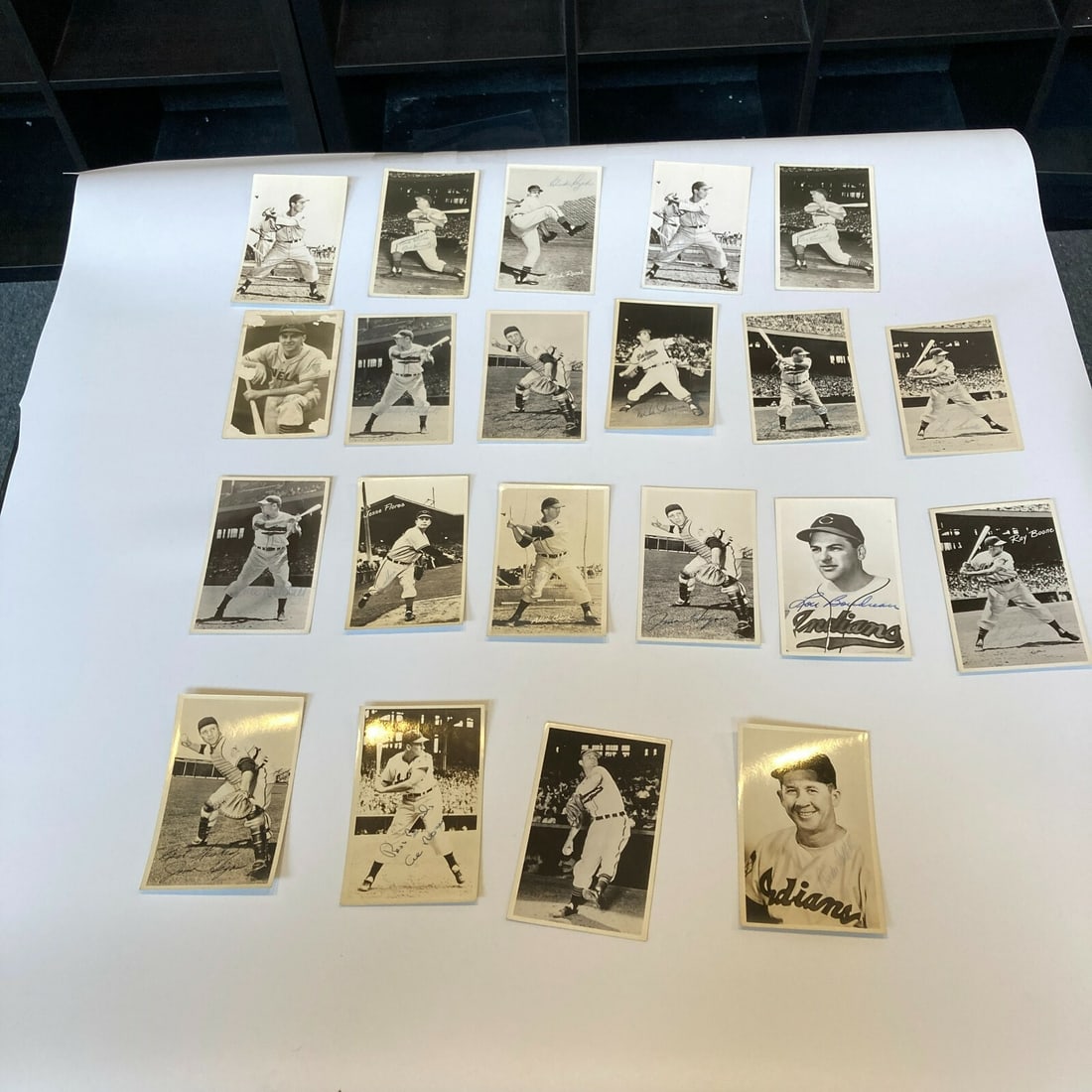 21 Signed 1950s Cleveland Indians Vintage Baseball Photos: 21 Signed 1950s Cleveland Indians Vintage Baseball Photos This lot features 21 vintage photos from the 1950s, showcasing members of the Cleveland Indians baseball team. Each photo is signed and autogr