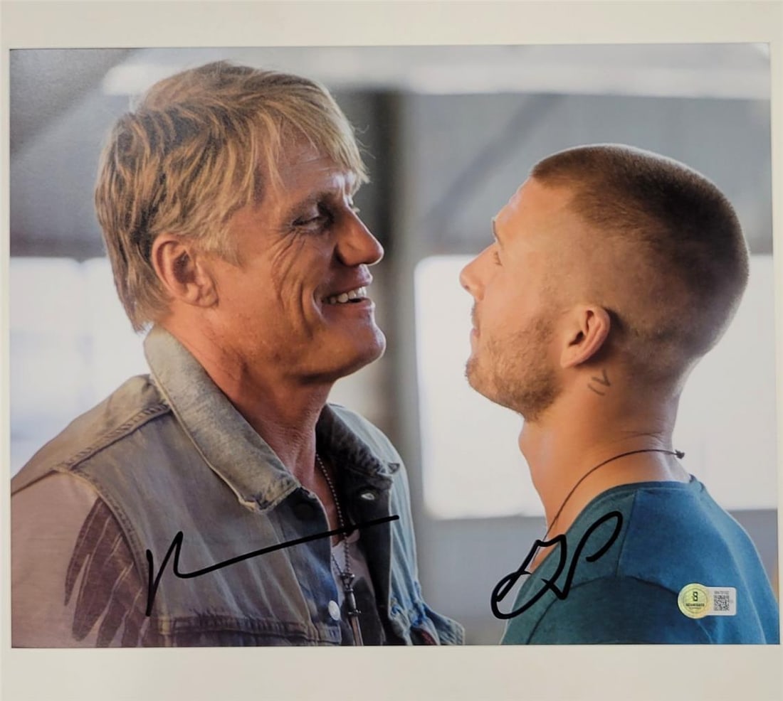 Expendables 11x14 Photograph Signed by Dolph Lundgren and Glen Powell Beckett Authenticated (1 of 3)