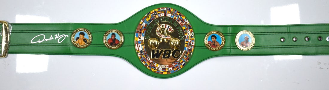 WBC Replica Belt Signed by Oscar De La Hoya with Beckett Hologram: WBC Replica Belt Signed by Oscar De La Hoya with Beckett Hologram This is a WBC replica belt autographed by Oscar De La Hoya. The belt includes a Beckett Witnessed hologram for authenticity. It is a p