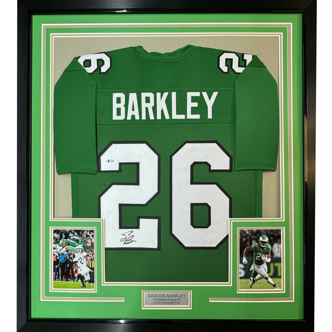 35x39 Framed Saquon Barkley Signed Eagles Jersey Beckett COA: 35x39 Framed Saquon Barkley Signed Eagles Jersey Beckett COA Professionally framed and matted original Saquon Barkley signed Kelly green football jersey display. The piece includes two 5x7 photos and 