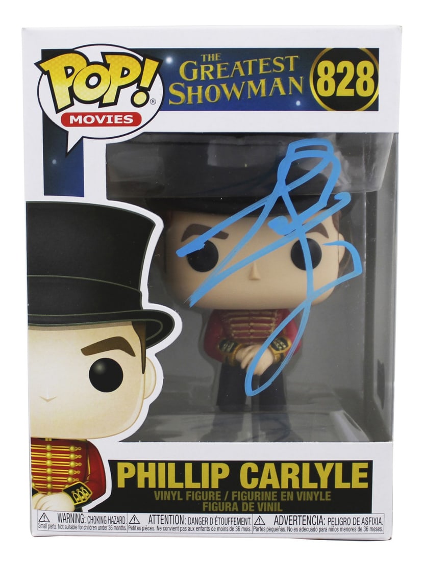 Phillip Carlyle Funko Pop #828 Signed by Zac Efron Beckett Authenticated: Phillip Carlyle Funko Pop #828 Signed by Zac Efron Beckett Authenticated This Phillip Carlyle #828 Funko Pop Vinyl Figure from The Greatest Showman has been personally signed by Zac Efron. The autogra