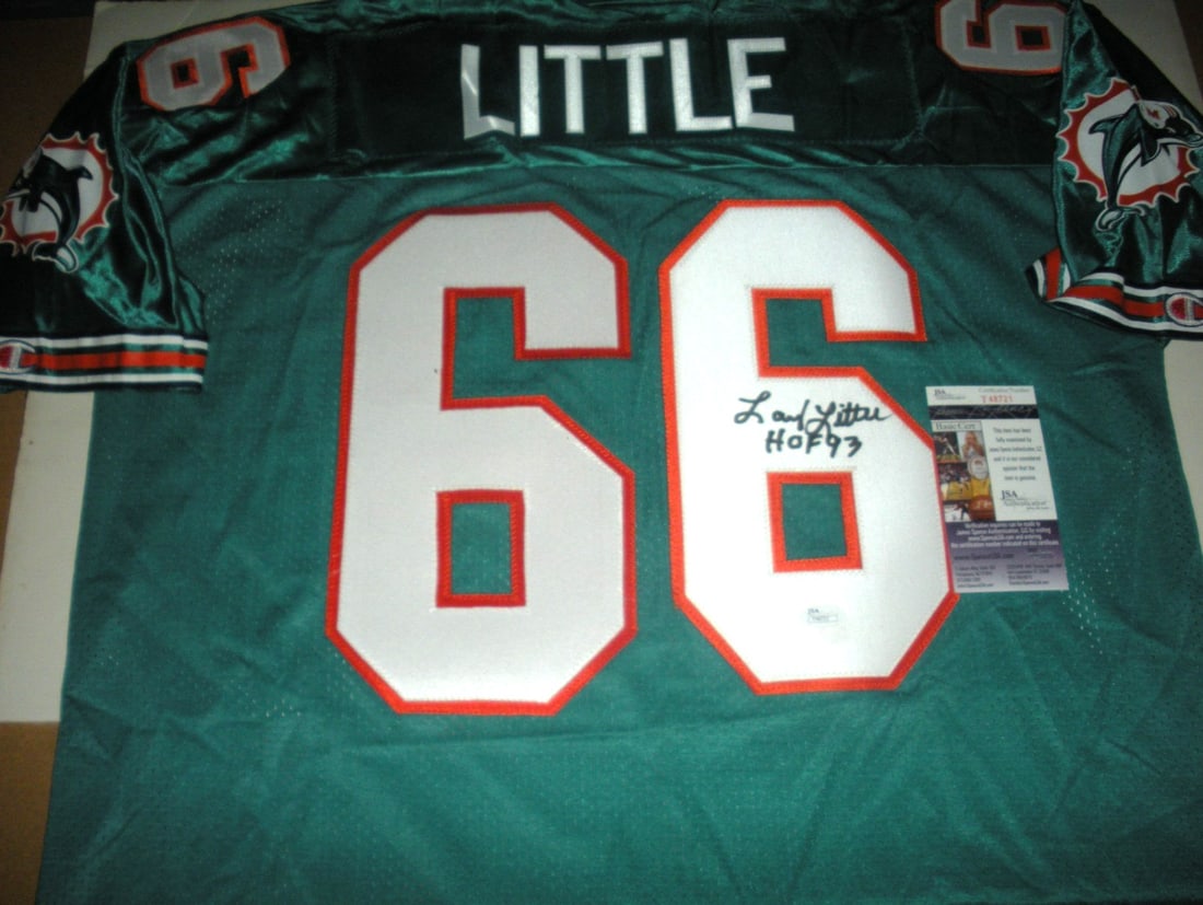 Miami Dolphins Jersey Signed by Larry Little with JSA COA: Miami Dolphins Jersey Signed by Larry Little with JSA COA This is a pre-owned official licensed Champion jersey signed by Larry Little of the Miami Dolphins. The jersey comes with JSA/COA authenticati