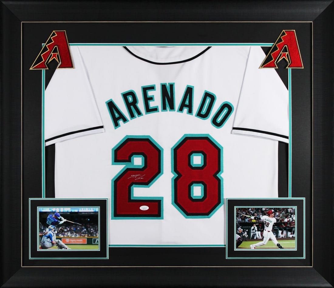 Framed White Pro Style Jersey Signed by Nolan Arenado JSA: Framed White Pro Style Jersey Signed by Nolan Arenado JSA This autographed white pro style framed jersey has been personally signed by Nolan Arenado of the Arizona Diamondbacks. It is an original item