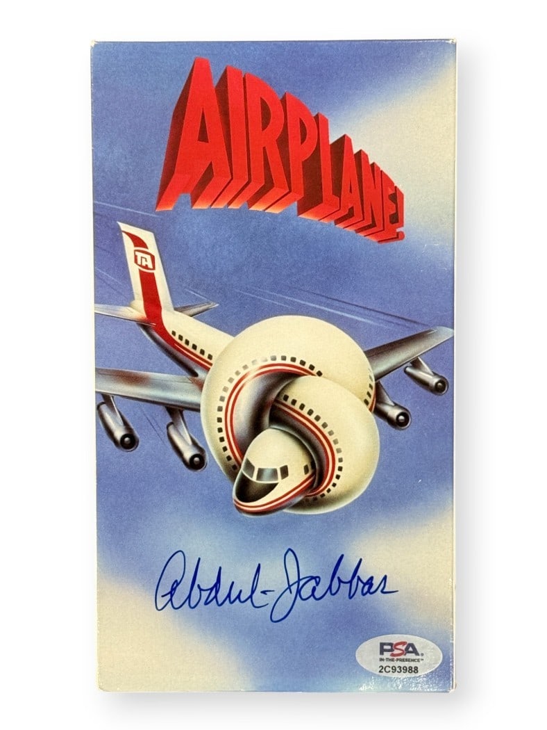 Autographed Airplane VHS Cover With Tape Kareem Abdul-Jabbar PSA Authenticated: Autographed Airplane VHS Cover With Tape Kareem Abdul-Jabbar PSA Authenticated This is an original VHS tape cover for the movie "Airplane," signed by Kareem Abdul-Jabbar. The autograph has been authen