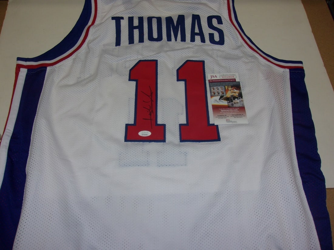Signed Isiah Thomas Detroit Pistons Jersey with JSA COA Commemorating 2X NBA Titles: Signed Isiah Thomas Detroit Pistons Jersey with JSA COA Commemorating 2X NBA Titles This is a pre-owned Detroit Pistons jersey signed by Isiah Thomas, commemorating his achievement as a 2-time NBA cha