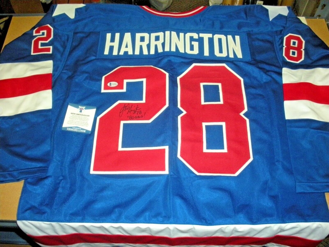 John Harrington 1980 Olympic Gold Signed Jersey Beckett Authenticated: John Harrington 1980 Olympic Gold Signed Jersey Beckett Authenticated This rare signed jersey features the autograph of John Harrington, a celebrated athlete who won a gold medal in hockey at the 1980