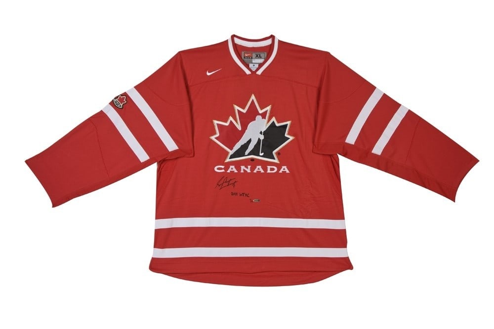 Sean Couturier Autographed Team Canada Jersey Limited Edition #/14: Sean Couturier Autographed Team Canada Jersey Limited Edition #/14 This is an original, autographed Team Canada red jersey signed by Sean Couturier, commemorating the 2011 World Junior Hockey Champion