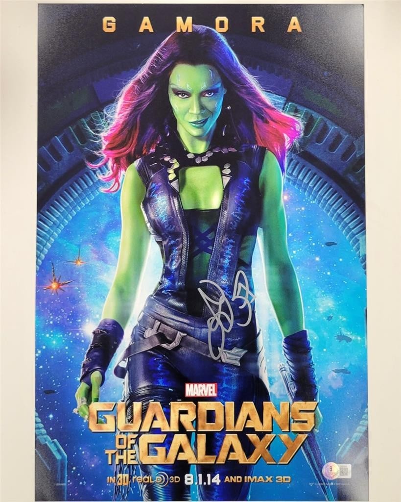 Autographed 12x18 Gamora Photograph Signed by Zoe Saldana Beckett Authenticated: Autographed 12x18 Gamora Photograph Signed by Zoe Saldana Beckett Authenticated This is an original 12x18 photograph poster featuring Gamora from Guardians, personally signed by Zoe Saldana. The autog