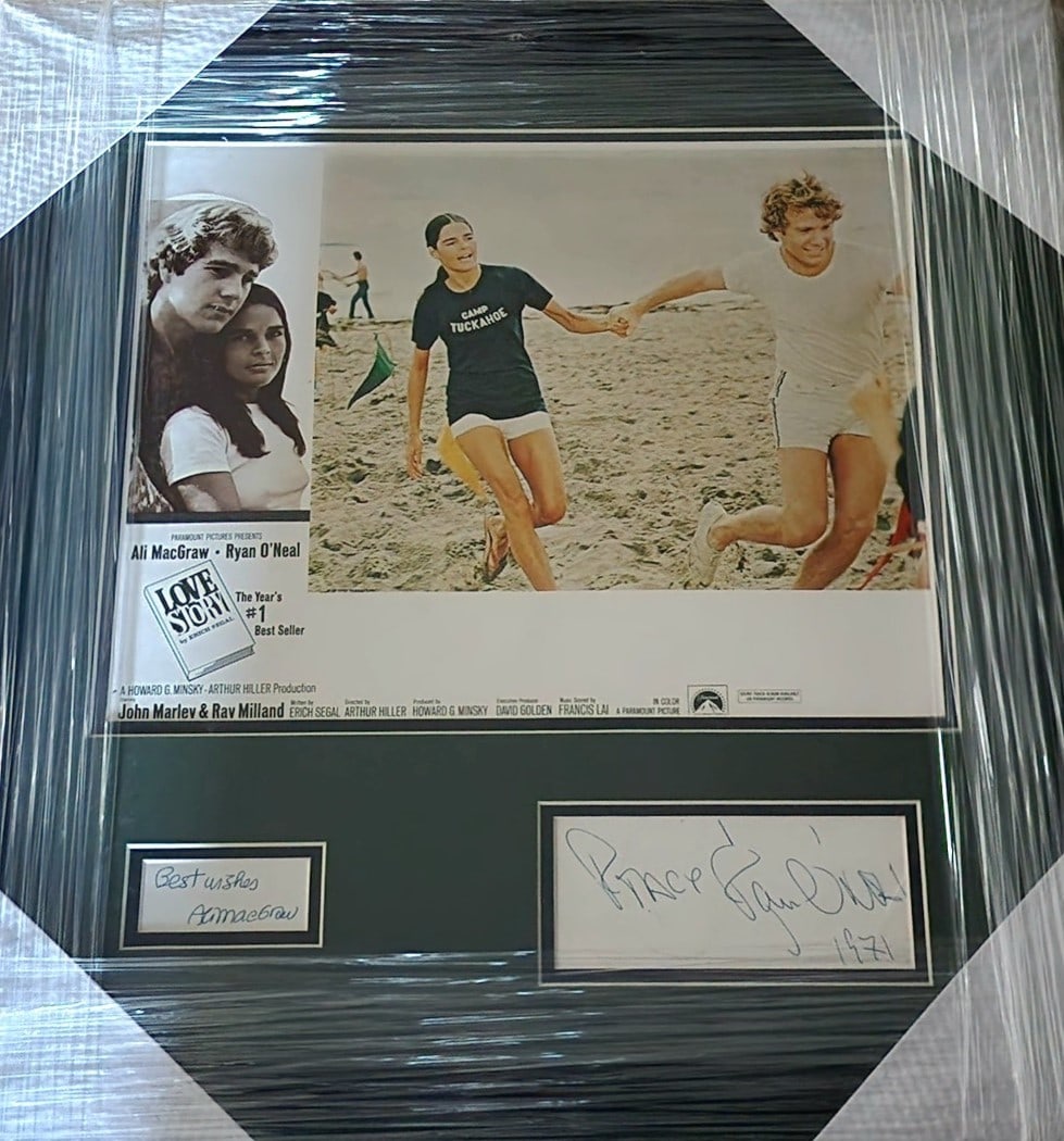 Love Story Framed Autographed Photograph Ali MacGraw Ryan O'Neal JSA Authenticated: Love Story Framed Autographed Photograph Ali MacGraw Ryan O'Neal JSA Authenticated This framed photograph features the iconic cast signatures from the classic film "Love Story," including Ali MacGraw 