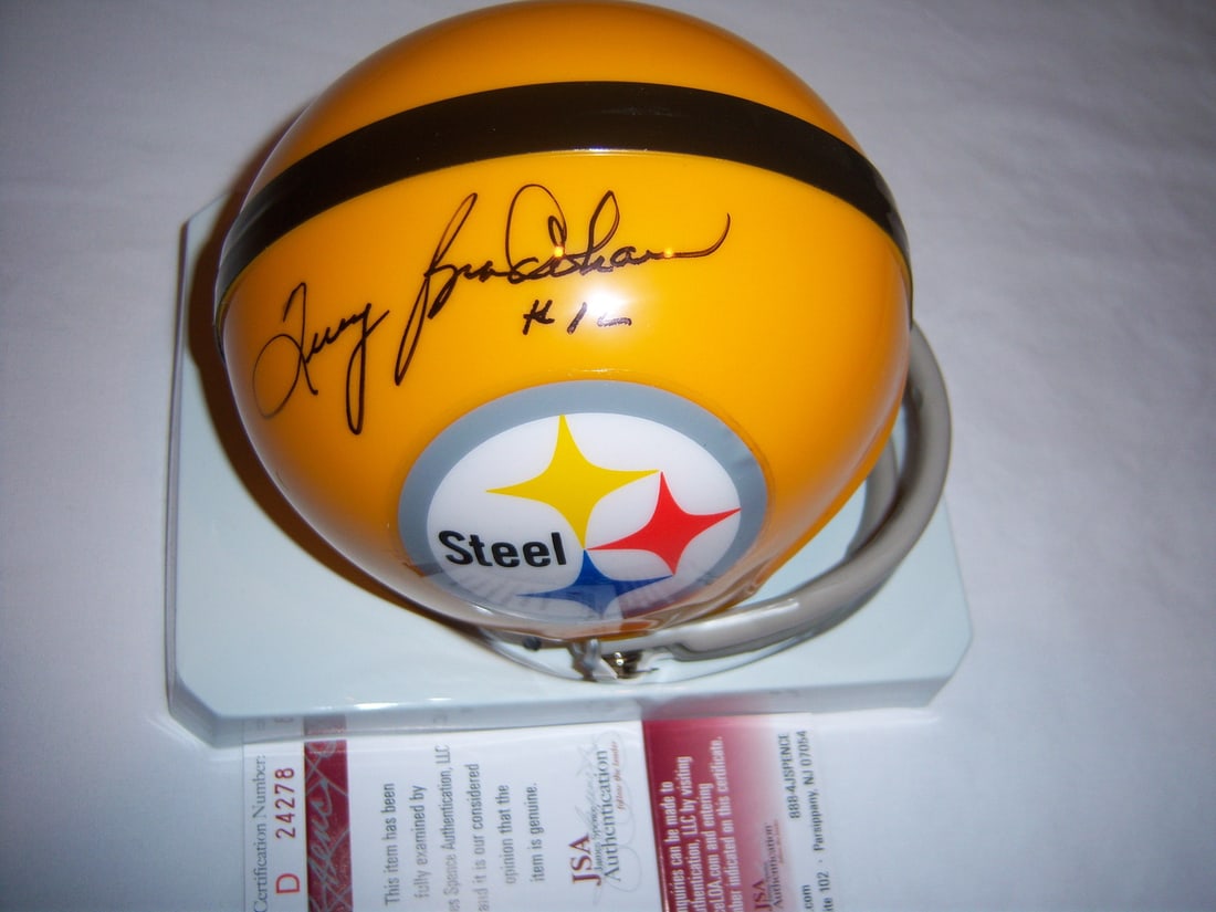 Signed Terry Bradshaw Pittsburgh Mini Helmet with JSA Certificate: Signed Terry Bradshaw Pittsburgh Mini Helmet with JSA Certificate This is a pre-owned Pittsburgh Steelers mini helmet, signed by Terry Bradshaw. The helmet is an original item and includes JSA/COA aut