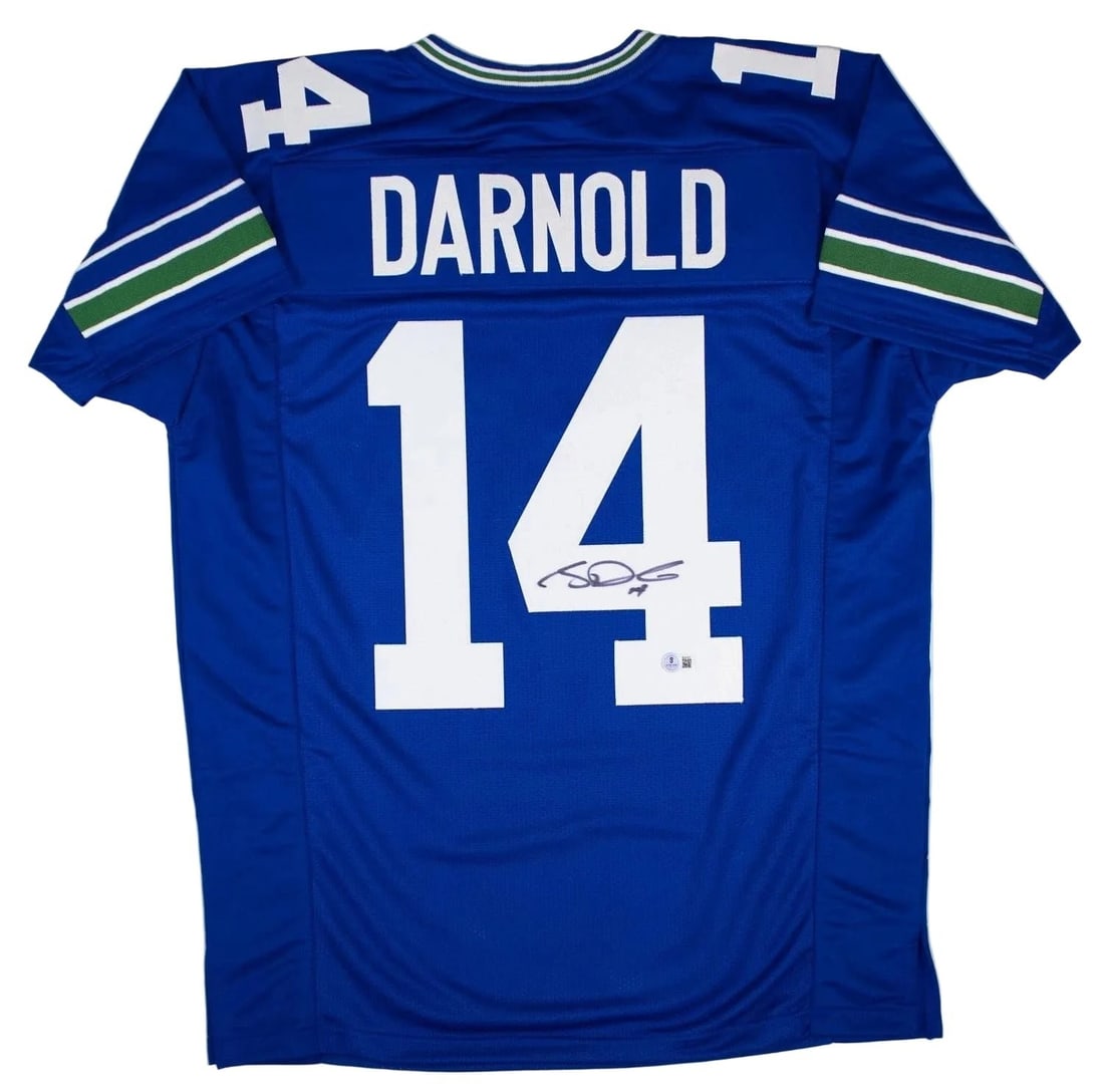 Beckett BAS certified Sam Darnold signed Seattle throwback football jersey: Beckett BAS certified Sam Darnold signed Seattle throwback football jersey Autographed Sam Darnold Seattle retro custom jersey intended as a collectible display piece. The jersey features the player's