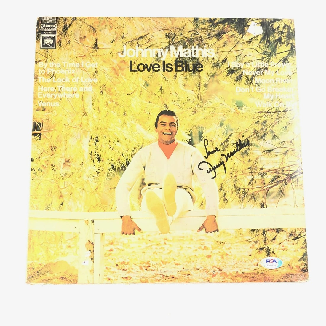 Johnny Mathis Signed Love Is Blue LP Vinyl PSA/DNA Authenticated: Johnny Mathis Signed Love Is Blue LP Vinyl PSA/DNA Authenticated This listing features a signed vinyl cover of Johnny Mathis' album "Love Is Blue." The autograph has been authenticated by PSA/DNA, ens