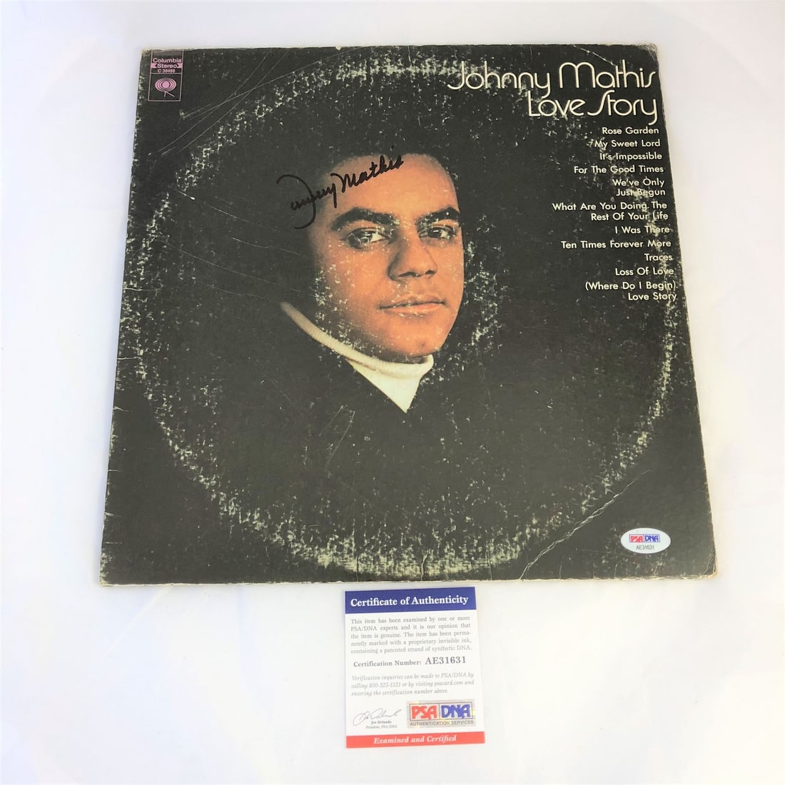 Johnny Mathis Autographed Love Story Vinyl Album PSA/DNA Certified: Johnny Mathis Autographed Love Story Vinyl Album PSA/DNA Certified This authentic Johnny Mathis Love Story Vinyl Album cover features a signature by the legendary artist himself. The autograph has bee