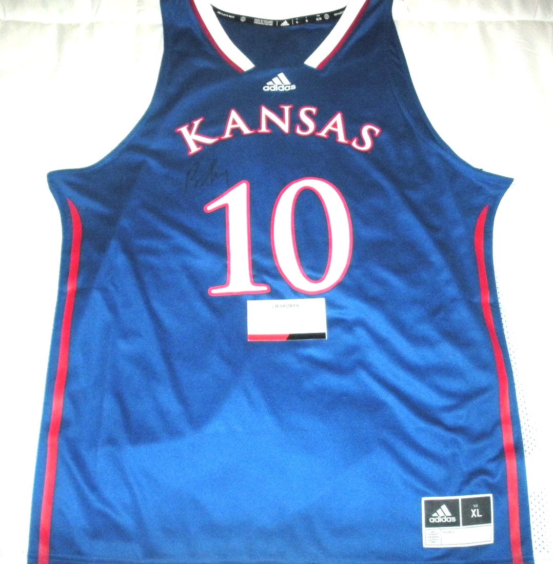 Adidas Kansas Jayhawks Official Jersey Signed by Bill Self with COA: Adidas Kansas Jayhawks Official Jersey Signed by Bill Self with COA Pre-owned original Adidas licensed basketball jersey signed by Bill Self. The title indicates Kansas Jayhawks and HOF with COA. Spec