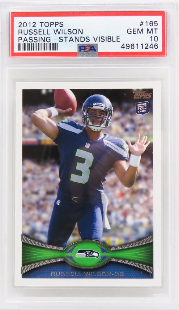 Russell Wilson 2012 Topps Rookie Card #165 PSA 10 Gem Mint: Russell Wilson 2012 Topps Rookie Card #165 PSA 10 Gem Mint Celebrate Russell Wilson's incredible career with this 2012 Topps Stands Visible Rookie Card #165. Encapsulated and graded Gem Mint 10 by Pro