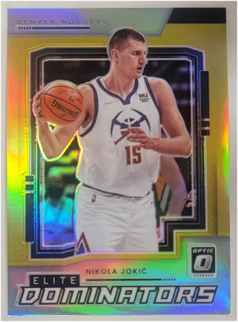 Nikola Jokic 2021-22 Panini Elite Dominators Gold Prizm 08/10: Nikola Jokic 2021-22 Panini Elite Dominators Gold Prizm 08/10 This is a 2021-22 Panini Elite Dominators basketball card featuring Nikola Jokic, a standout player for the Denver Nuggets. The card is a 