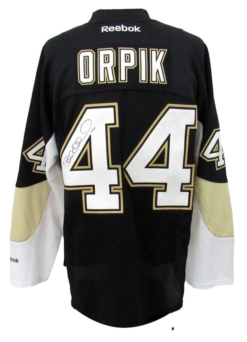 Brooks Orpik Signed Black Reebok Penguins Jersey with COA: Brooks Orpik Signed Black Reebok Penguins Jersey with COA This is a Brooks Orpik signed Pittsburgh Penguins Authentic Reebok hockey jersey in black, size XL. The jersey features the team logo and is o