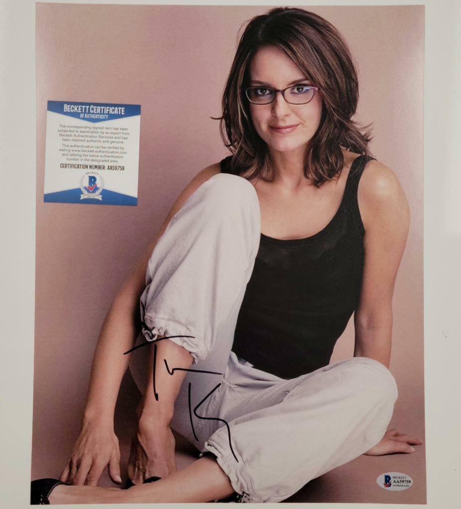 11x14 Tina Fey Autographed Photo with Beckett Authentication: 11x14 Tina Fey Autographed Photo with Beckett Authentication This is an original 11x14 photograph signed by actress Tina Fey. The autograph is authenticated by Beckett and the item originates from the