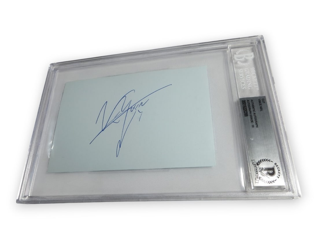 Motley Crue Vince Neil Hand Signed Cut Card Beckett Authenticated: Motley Crue Vince Neil Hand Signed Cut Card Beckett Authenticated This is an original cut signature card autographed by Vince Neil, the lead singer of Motley Crue. The signature has been professionall