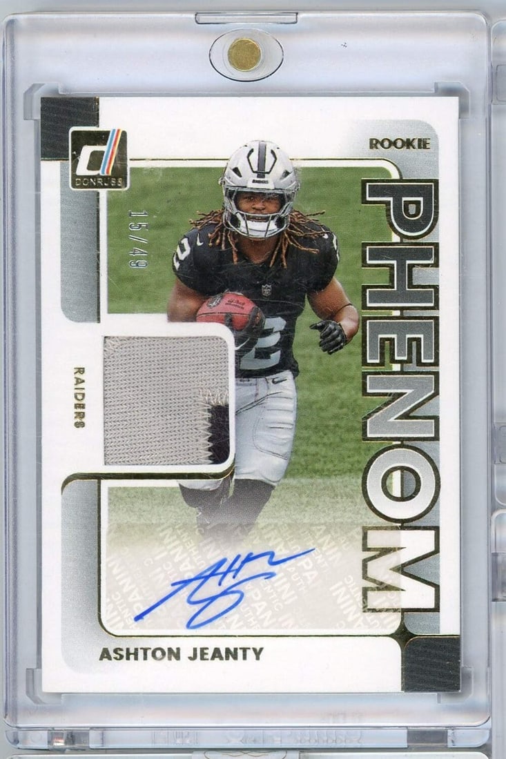 Ashton Jeanty Rookie Phenom RPA Card Panini Donruss 2025 Auto Serial Numbered /49: Ashton Jeanty Rookie Phenom RPA Card Panini Donruss 2025 Auto Serial Numbered /49 This is an original 2025 Panini Donruss Ashton Jeanty Rookie Phenom RPA #PJAAJY card, limited to 49 produced. The card