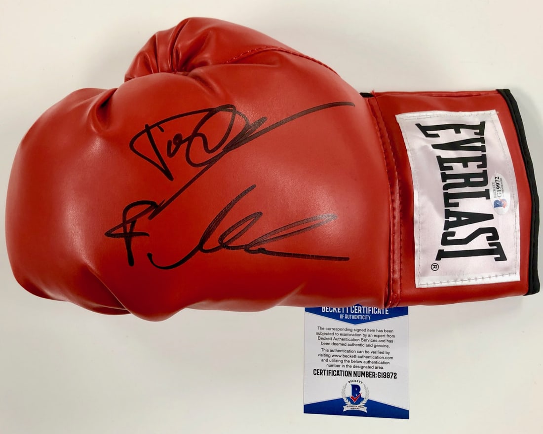 Boxing Glove Autographed by Dolph Lundgren and Florian Munteanu Beckett COA: Boxing Glove Autographed by Dolph Lundgren and Florian Munteanu Beckett COA This original boxing glove is signed by Dolph Lundgren and Florian Munteanu, known for their roles as Drago and Creed. The a
