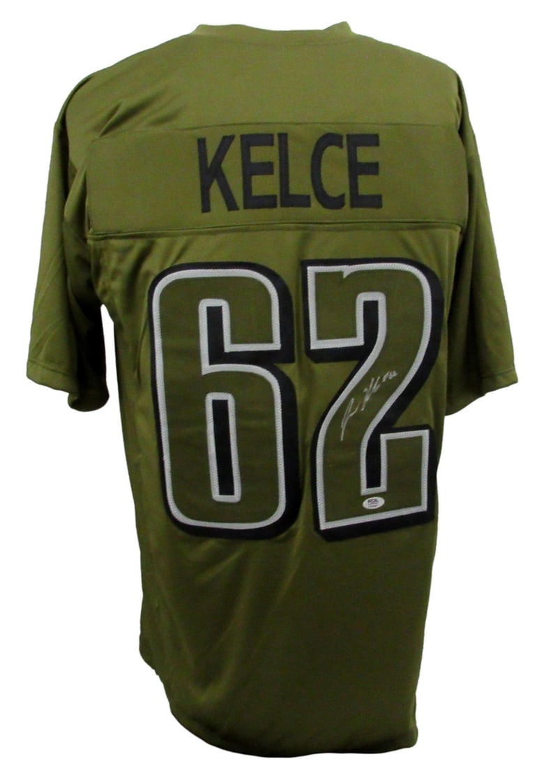 Jason Kelce Signed Army Green Eagles Jersey PSA DNA Authenticated: Jason Kelce Signed Army Green Eagles Jersey PSA DNA Authenticated This is a pre-owned, army green custom football jersey autographed by Jason Kelce of the Philadelphia Eagles. The jersey is size XL an
