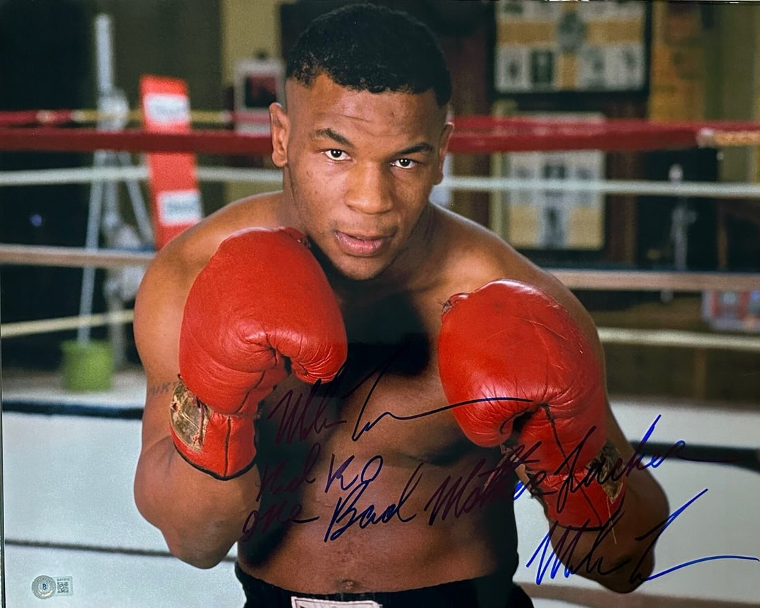 Mike Tyson Signed 16x20 Photo with Inscription Beckett Certified: Mike Tyson Signed 16x20 Photo with Inscription Beckett Certified This impressive 16x20 photograph captures boxing legend Mike Tyson in a powerful moment, enhanced by his bold blue permanent marker sig