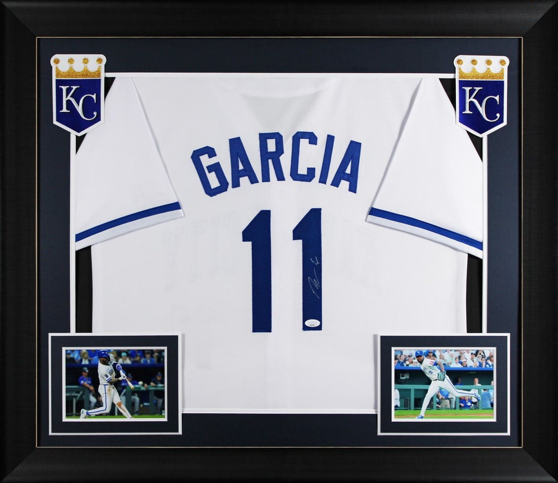 Framed Pro Style Jersey Signed by Maikel Garcia JSA Authenticated: Framed Pro Style Jersey Signed by Maikel Garcia JSA Authenticated This white pro style jersey has been personally autographed by Maikel Garcia of the Kansas City Royals. The jersey is custom-stitched,