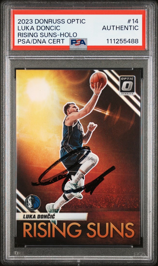 Luka Doncic Autographed 2023 Donruss Optic Holo #14 PSA Slabbed Card: Luka Doncic Autographed 2023 Donruss Optic Holo #14 PSA Slabbed Card This 2023 Donruss Optic Risings Suns Holo #14 Card has been personally signed by Luka Doncic, the star player of the Dallas Maveric