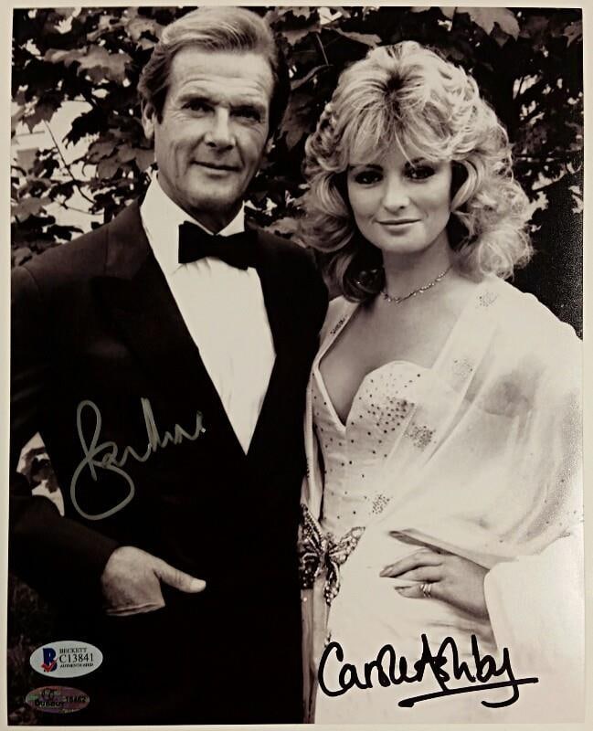James Bond 8x10 Photo Signed by Roger Moore and Carole Ashby Beckett Authenticated: James Bond 8x10 Photo Signed by Roger Moore and Carole Ashby Beckett Authenticated This original 8x10 inch photograph features the signatures of Roger Moore and Carole Ashby from the James Bond 007 se
