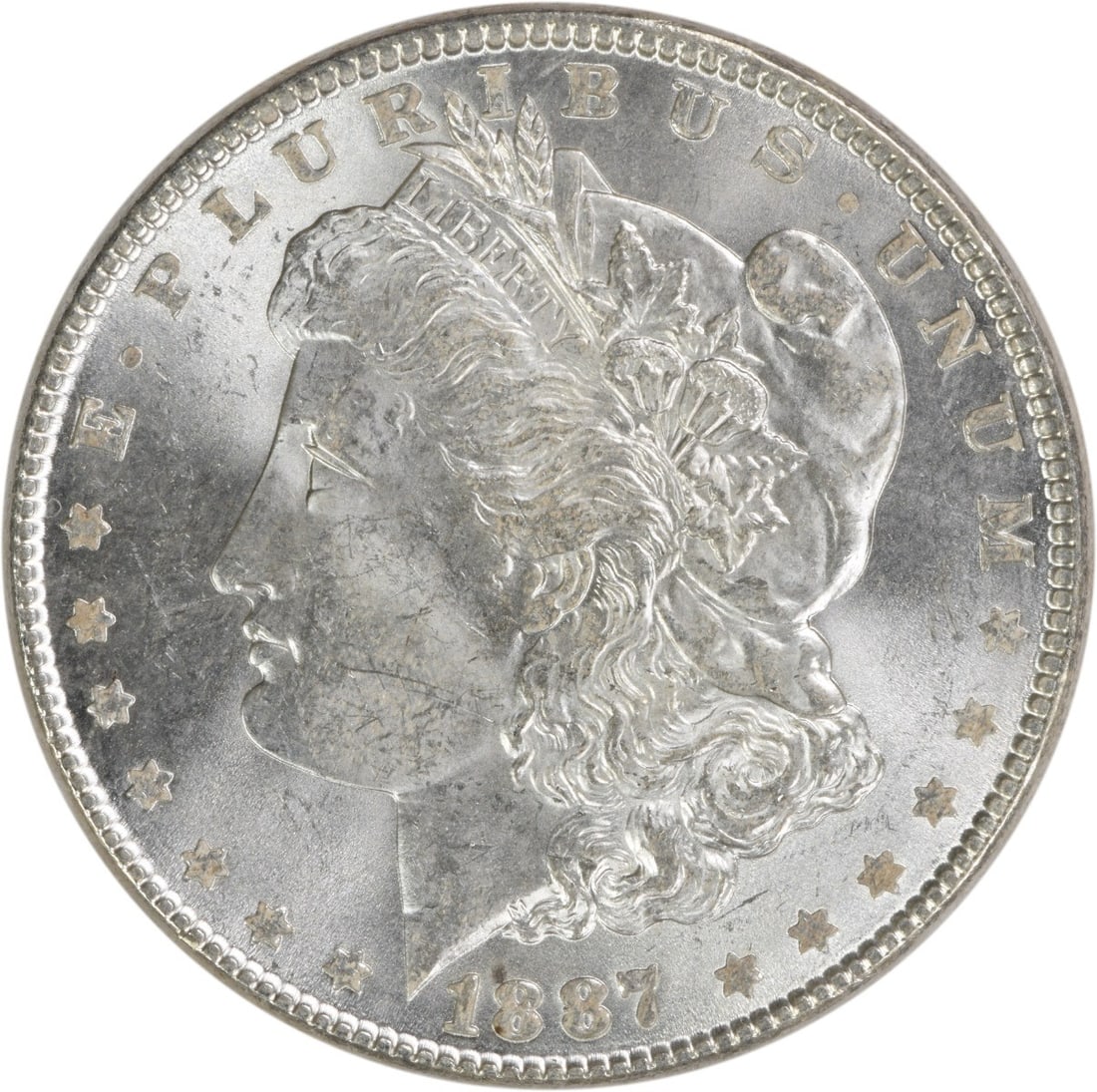 Brilliant Uncirculated 1887 Silver Morgan Dollar Uncertified No Mint Mark: Brilliant Uncirculated 1887 Silver Morgan Dollar Uncertified No Mint Mark This 1887 Morgan Silver Dollar is an uncirculated coin featuring brilliant uncirculated (BU) quality. It is composed of silver