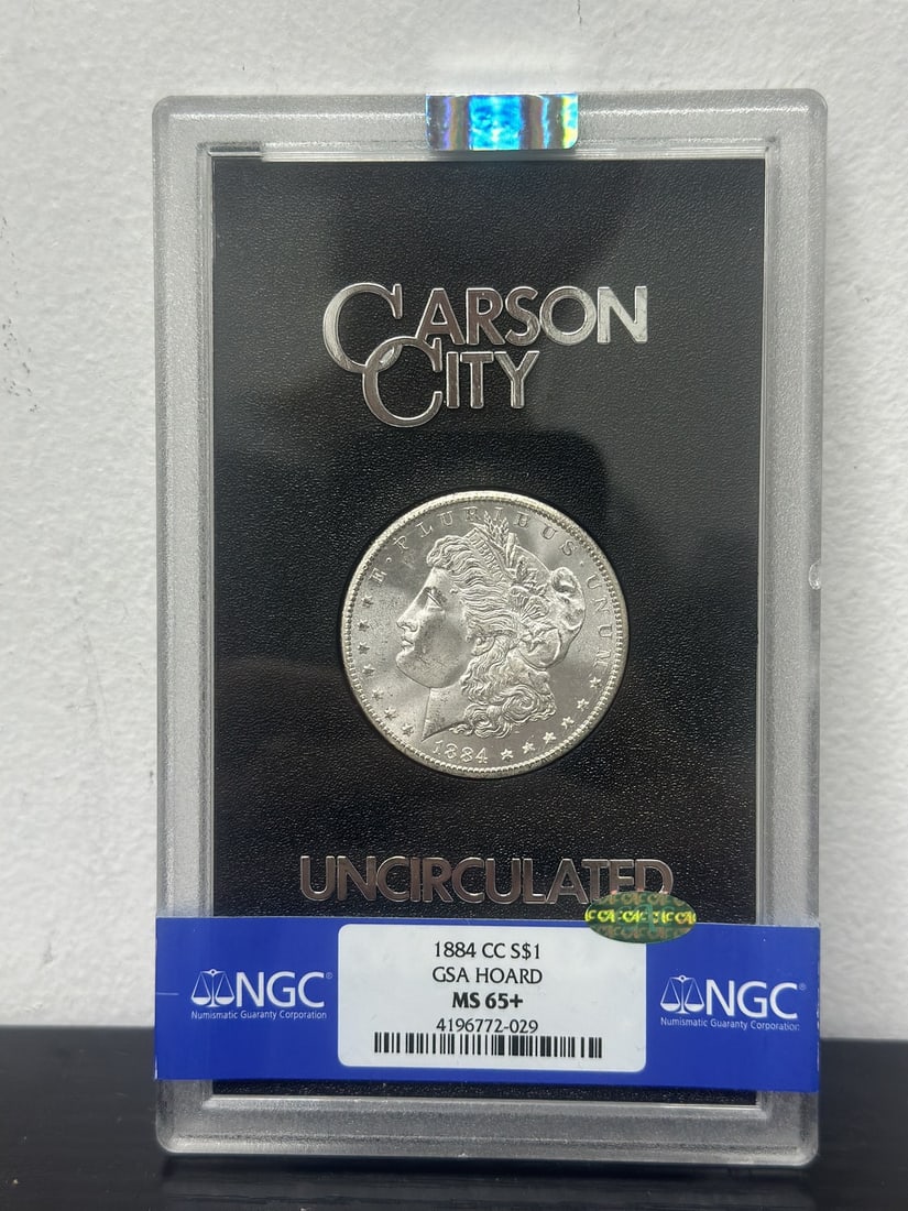 1884 Carson City Morgan Silver Dollar NGC MS65+ CAC GSA: 1884 Carson City Morgan Silver Dollar NGC MS65+ CAC GSA 1884-CC Morgan Silver Dollar certified by NGC with a MS65+ grade and CAC designation. This pre-owned Carson City issue is struck in silver and c