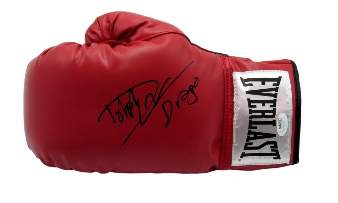Dolph Lundgren Signed Left Boxing Glove Balboa vs Drago JSA Authenticated: Dolph Lundgren Signed Left Boxing Glove Balboa vs Drago JSA Authenticated This listing features an original, autographed left boxing glove from Dolph Lundgren, famously inscribed with "Drago" and depi