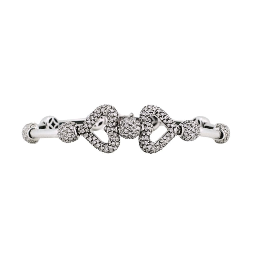 Unbranded 18K White Gold Heart Bracelet with Pave Diamonds 1.50 CTW: Unbranded 18K White Gold Heart Bracelet with Pave Diamonds 1.50 CTW Refined heart bracelet crafted in 18K white gold and set with natural round brilliant diamonds in a pave setting. This pre-owned bra