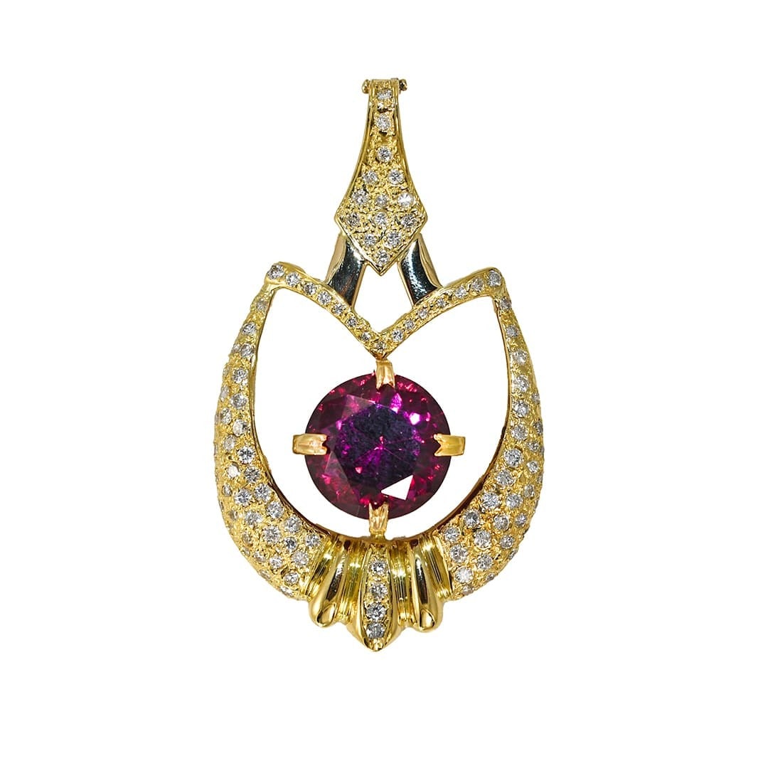 Unbranded 18k Yellow Gold Pendant with Garnet and Diamond Accents: Unbranded 18k Yellow Gold Pendant with Garnet and Diamond Accents Custom-made pendant featuring a natural pyrope-spessartine garnet in a reddish-purple hue, accented by pave-set round brilliant diamon