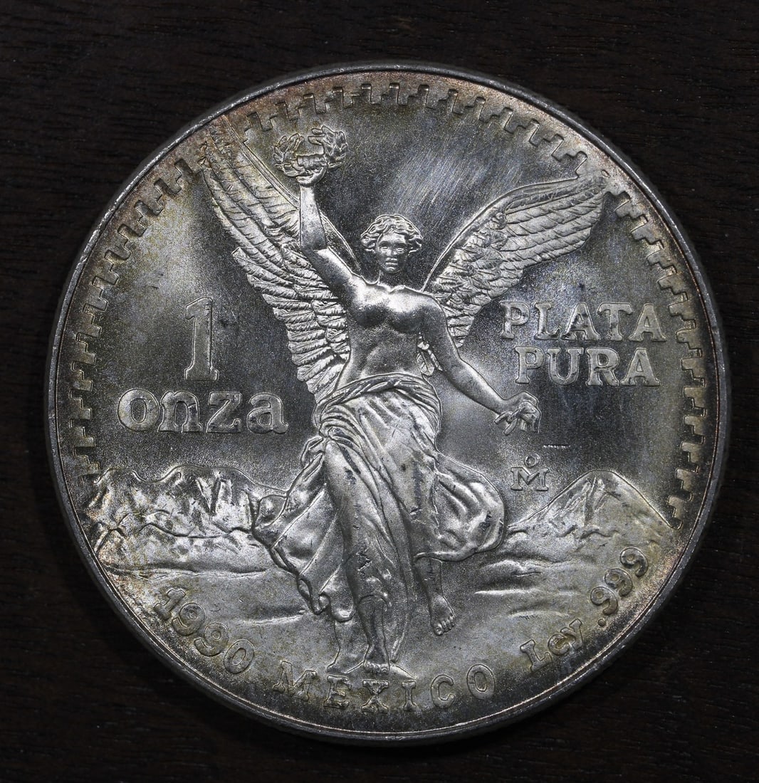 Mexico 1990-Mo 1 oz .999 Silver Libertad Onza Coin: Mexico 1990-Mo 1 oz .999 Silver Libertad Onza Coin 1990-Mo Mexico 1 oz Silver Libertad Onza coin struck by the Mexican Mint. This pre-owned piece contains 1 oz of .999 fine silver and is offered in un
