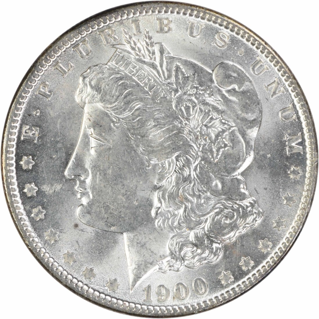 1900 Uncirculated Morgan Silver Dollar Philadelphia Mint Uncertified: 1900 Uncirculated Morgan Silver Dollar Philadelphia Mint Uncertified 1900 Morgan Silver Dollar in uncirculated condition. This uncertified coin is composed of 90% silver and 10% copper and features th