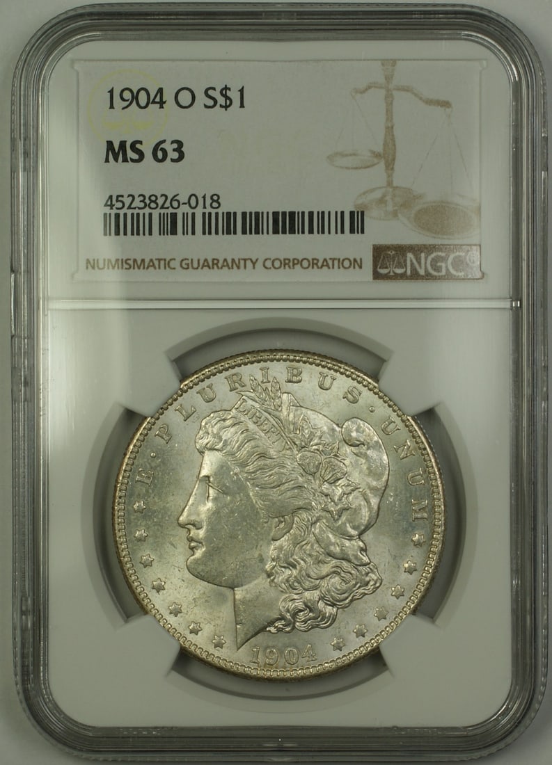 NGC MS 63 1904 O Morgan Dollar Silver $1 Coin: NGC MS 63 1904 O Morgan Dollar Silver $1 Coin 1904-O Morgan Silver Dollar $1 coin certified by NGC and graded MS-63. This United States coin is an uncirculated Morgan Dollar struck in silver. Pre-owne